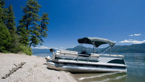 Pontoon boat flooring installed on beached pontoon highlighting carpet and vinyl deck surfaces for comfort and water resistance