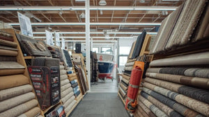 showroom displaying rolls of marine flooring and 20oz boat carpet options for durability and performance